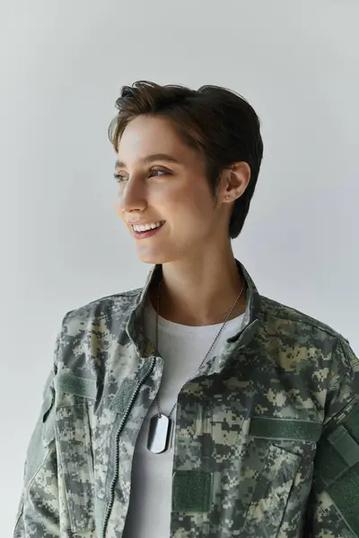 A loving farewell as woman for military service in a studio setting. — Stock Photo