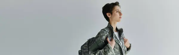 A soldier in camouflage prepares for deployment, banner — Stock Photo