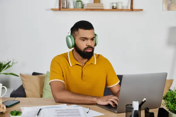 Man deeply engaged in work at home, enjoying a moment of concentration. — Stock Photo