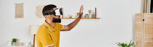 A man immersed in a virtual reality adventure, exploring new worlds. — Stock Photo