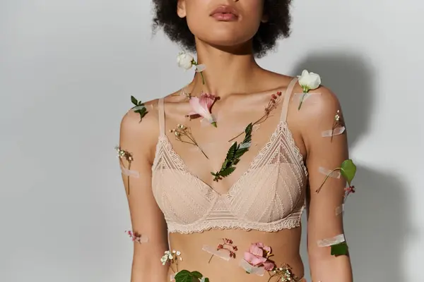 Chic african american woman with beautiful plants on her body and underwear. — Stock Photo