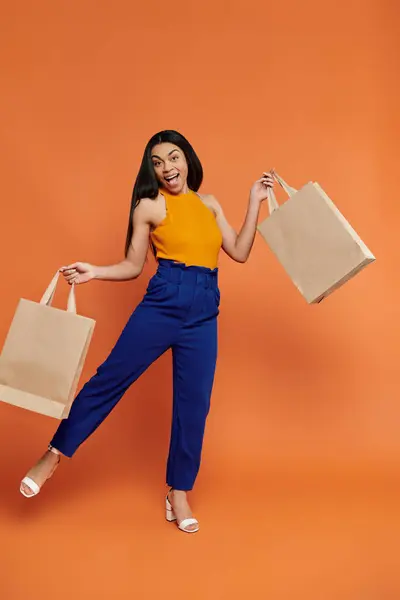 A vibrant moment of happiness with shopping bags in hand. — Stock Photo