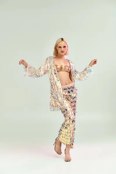 A fashionable young woman showcases her striking holographic outfit. — Stock Photo