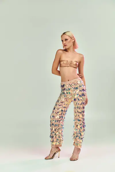 A stylish young woman showcases a stunning holographic outfit. — Stock Photo