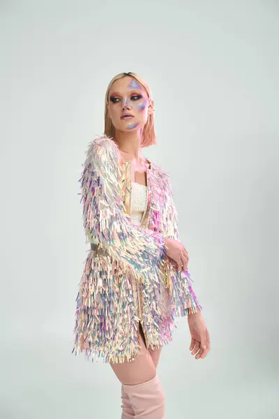 A young woman showcases vibrant fashion artistry with holographic elements. — Stock Photo
