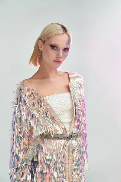 A stylish young woman showcases her holographic outfit with artistic flair. — Stock Photo