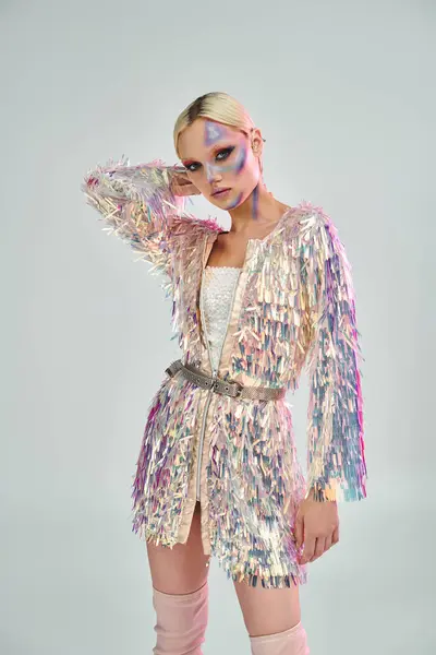 A stylish young woman presents her holographic attire with poise. — Stock Photo