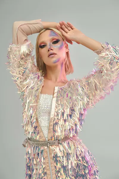 A fashionable young woman showcases her unique holographic style and artistic makeup. — Stock Photo