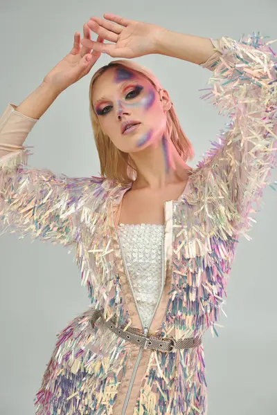 A fashionable young woman showcases her shimmering style and unique makeup. — Stock Photo