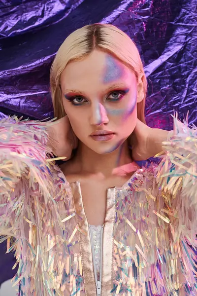 A young woman displays vibrant style with holographic flair and captivating makeup. — Stock Photo