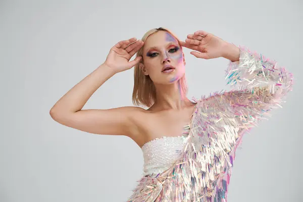 A stylish young woman poses elegantly with shimmering holographic elements. — Stock Photo