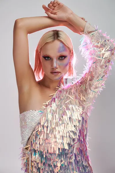 A stylish young woman showcases holographic fashion with a striking pose. — Stock Photo
