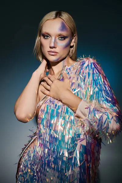 A stylish young woman showcases a holographic ensemble with artistic makeup. — Stock Photo
