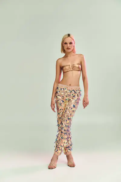 A young woman dazzles in holographic attire, exuding confidence and elegance. — Stock Photo
