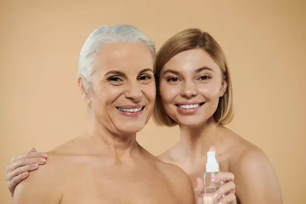 Two women share a joyful moment, showcasing their beauty and connection. — Stock Photo