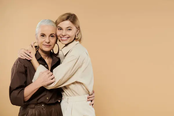 A joyful embrace captures the bond shared between a mother and her daughter. — Stock Photo