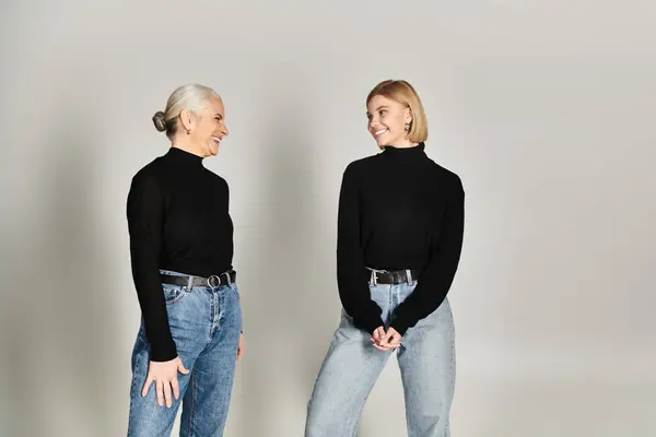 A mature woman and her daughter share a lighthearted conversation. — Stock Photo