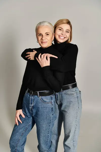 A warm moment shared between a mother and her adult daughter. — Stock Photo