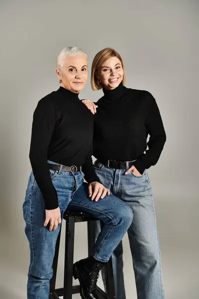 A mature woman and her adult daughter share a joyful moment together. — Stock Photo
