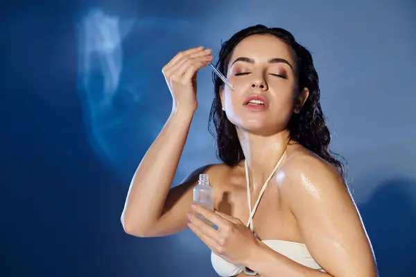 A young woman indulges in her skincare routine with a radiant smile. — Stock Photo