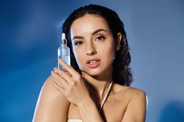 A woman showcases her beauty regimen holding a skincare product with confidence. — Stock Photo