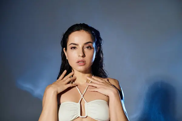 A young woman demonstrates her skincare routine with elegance and poise. — Stock Photo
