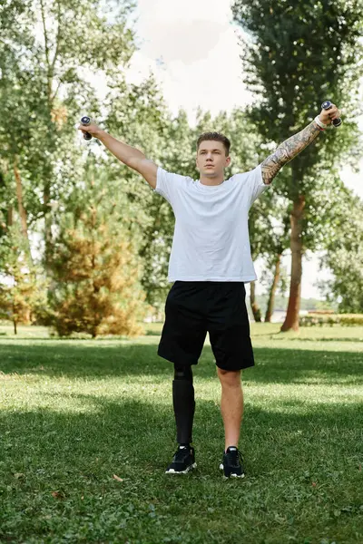 Man workout in a park, celebrating strength and diversity amidst nature. — Stock Photo