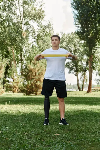 Man with disability workout in a park, celebrating strength and motivation through fitness. — Stock Photo