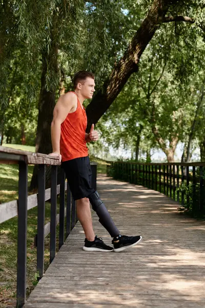 Man enjoying an outdoor workout, showcasing strength amidst nature, showing thumb up — Stock Photo