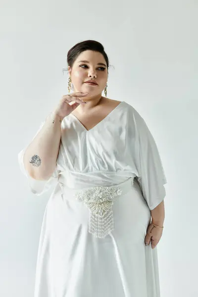 A stunning bride radiates confidence in her exquisite white dress, adorned with elegant earrings. — Stock Photo
