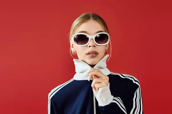 A confident sportswoman showcases her emotional depth while dressed in fashionable athletic wear. — Stock Photo