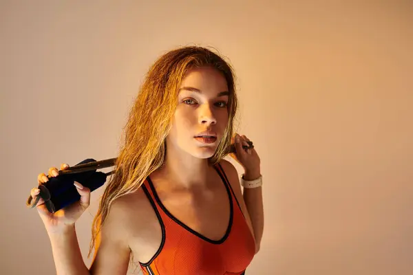 A stunning athlete conveys emotion with a dynamic pose and striking lighting. — Stock Photo