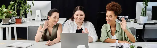 Confident women engage in a productive virtual meeting within a stylish office space. — Stock Photo