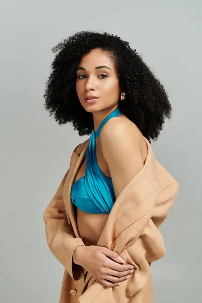 A fashionable woman showcases her unique style with confidence, blending elegance and modern trends. — Stock Photo