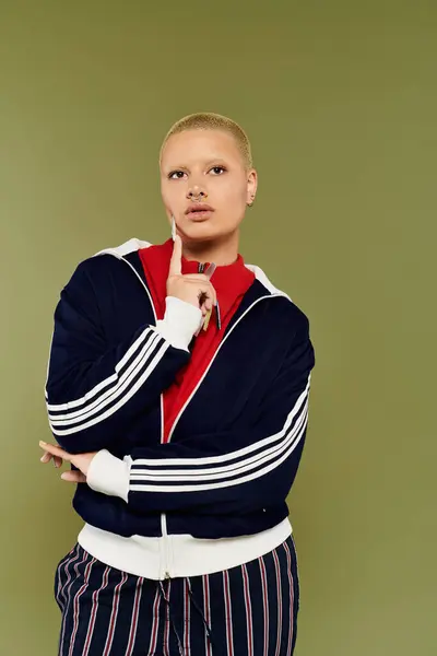 This unique individual showcases a bold expression while modeling colorful apparel. — Stock Photo