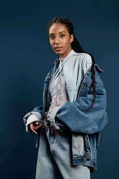 A young woman showcases her fashionable style, exuding confidence in a vibrant atmosphere. — Stock Photo