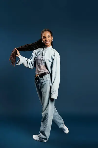 This stylish young woman confidently showcases casual fashion, exuding energy and grace. — Stock Photo