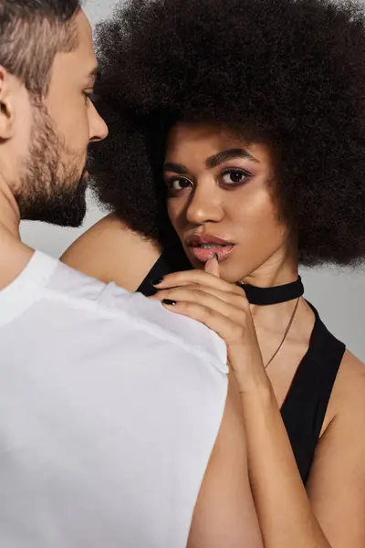 A tender interaction unfolds as a couple shares a playful gaze, highlighting their deep connection. — Stock Photo