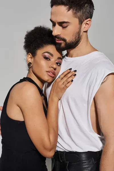 A couple shares an intimate moment, exuding love and connection in a modern studio. — Stock Photo