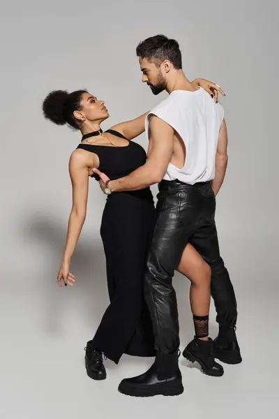 A loving couple shares an intimate moment, expressing passion through dance and connection. — Stock Photo