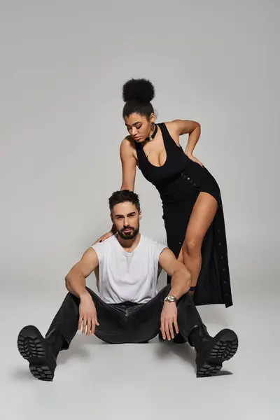A passionately connected couple showcases their love through a striking pose in elegant attire. — Stock Photo