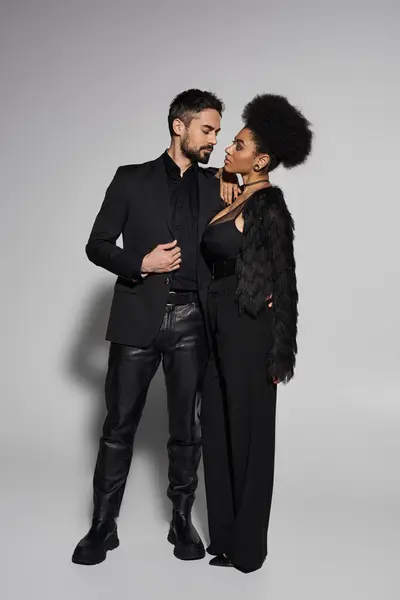 A stylish couple shares an intimate moment, radiating love and elegance in a modern setting. — Stock Photo