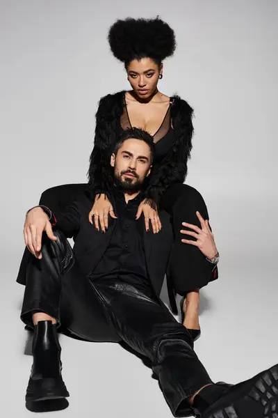 A couple displays their affection and confidence in a captivating pose, highlighting their bond. — Stock Photo