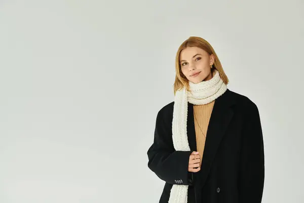 Graceful woman in elegant warm attire posing actively. — Stock Photo
