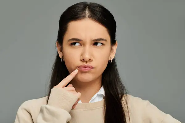 An elegantly dressed young woman shows her emotions with a thoughtful gesture. — Stock Photo