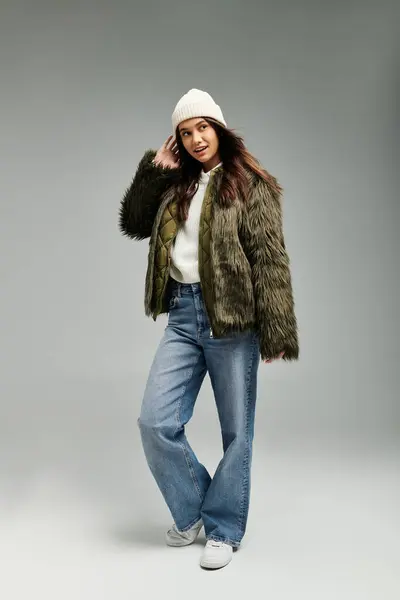 A young woman expresses her emotions through fashion, showcasing a trendy outfit with flair. — Stock Photo