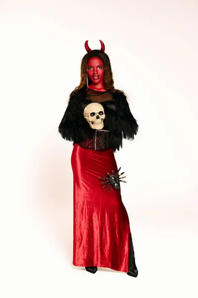 A beautiful woman dressed in a striking Halloween outfit, exuding confidence and allure. — Stock Photo