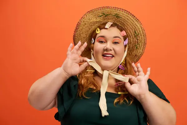 A joyful plus size woman beams, showcasing colorful hair accessories in a playful pose. — Stock Photo