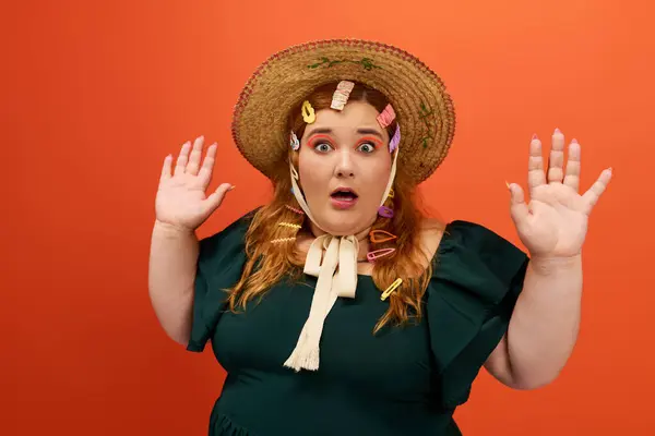 A beautiful plus size woman shows a surprised expression while playfully posing. — Stock Photo