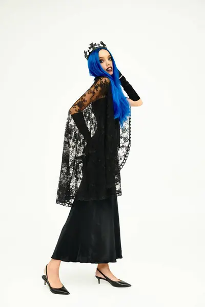 An artistic portrayal of a young woman in an elegant Halloween costume with striking blue hair. — Stock Photo